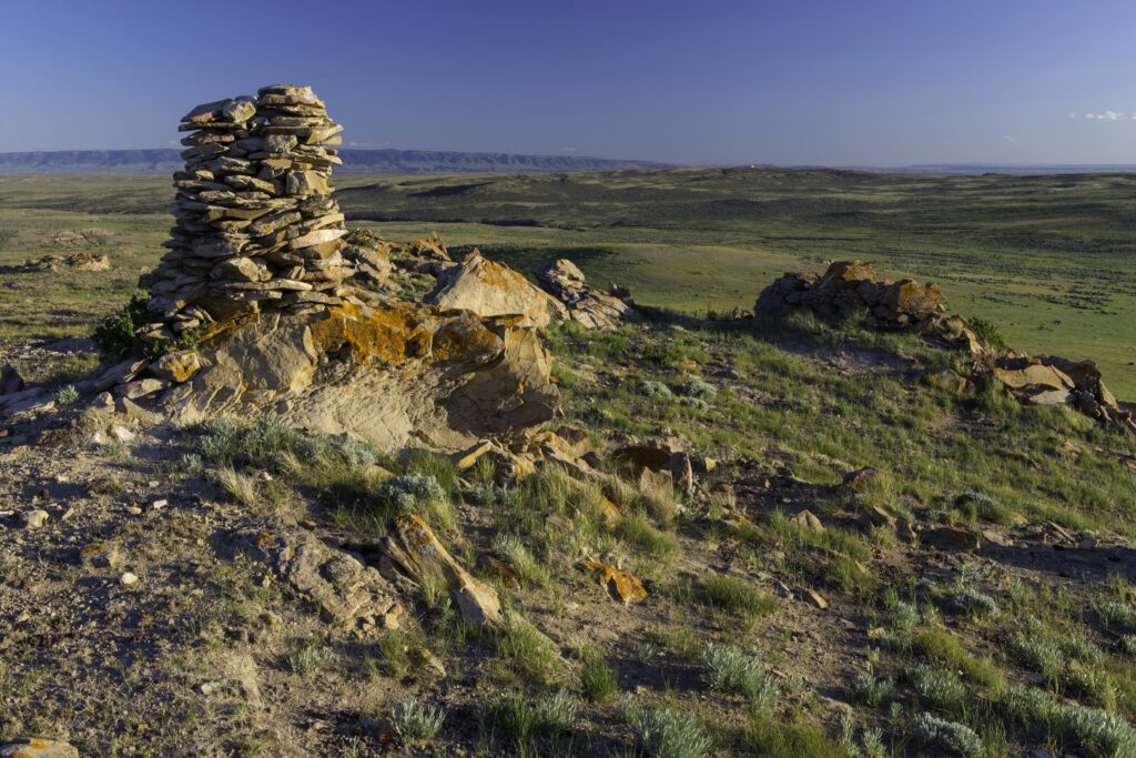A neat stack of rocks atop a hill
