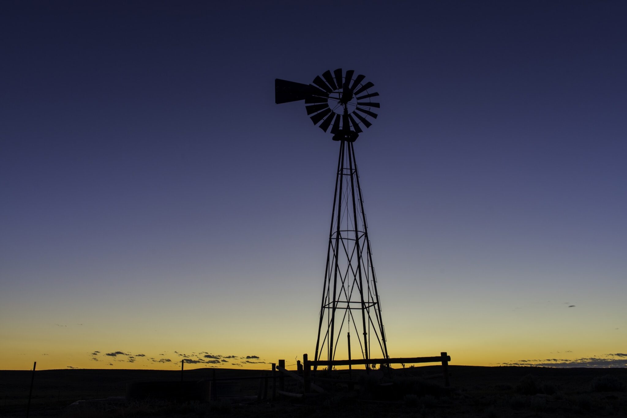 A windmill during sundown